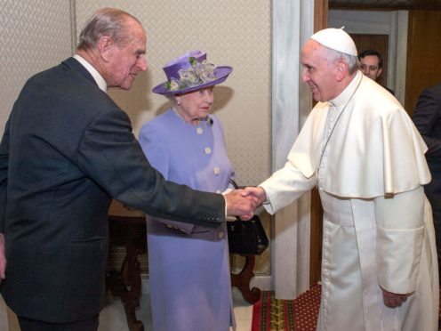 The Duke of Edinburgh shakes hands with Pope Francis as the Queen looks on (Arthur Edwards/The Sun/PA)