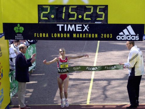 Paula Radcliffe crosses the line to set a new marathon world record (Rebecca Naden/PA)