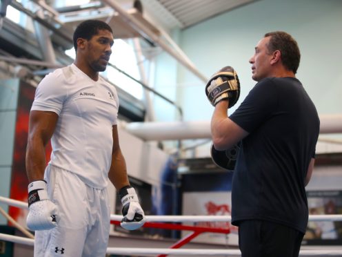 Anthony Joshua, left, might have to face Tyson Fury without Rob McCracken, right, in his corner (Nick Potts/PA)