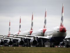 Nicola Sturgeon says that international travel still poses a Covid risk to Scotland (Andrew Milligan/PA)