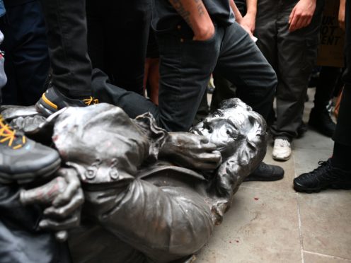 The Edward Colston statue after it was toppled (Ben Birchall/PA)