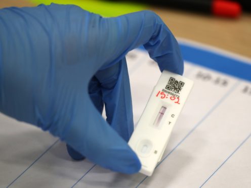 People carry out asymptomatic testing using lateral flow tests (Andrew Milligan/PA)