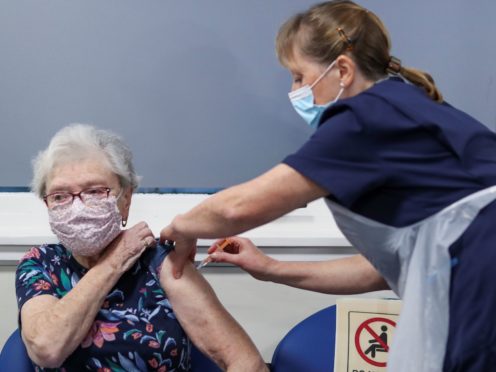 People are being urged to have their vaccination (Russell Cheyne/PA)