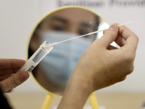 Past Covid infection ‘does not fully protect young people against reinfection’ (Andrew Milligan/PA)