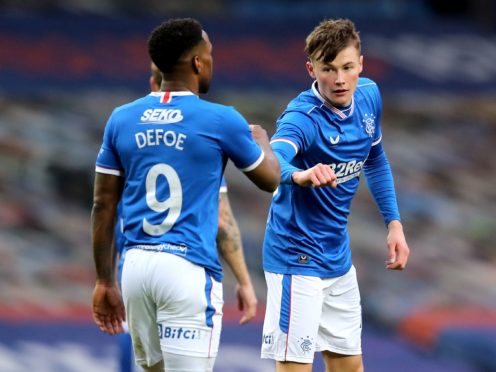 Jermain Defoe and Nathan Patterson (right) both struck during Rangers win over Cove (Jane Barlow/PA)