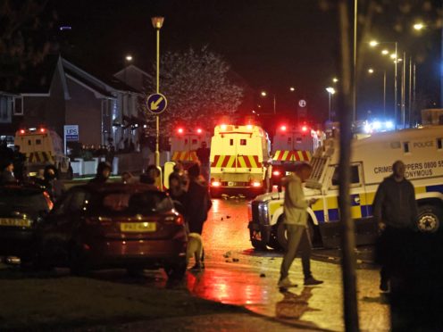 The PSNI on Northland in Carrickfergus near Belfast following sporadic outbursts of disorder (Liam McBurney/PA)