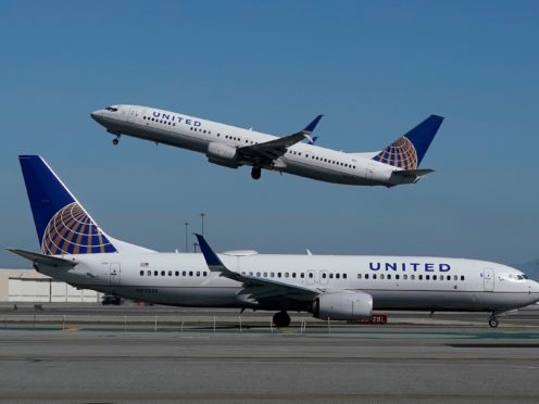 Airlines argue that filters and air-flow systems on most planes make them safe when passengers wear face masks (Jeff Chiu/AP)