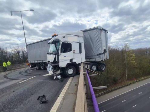 An HGV after it collided with the side of the M25 at Junction 2 (Highways England/PA)