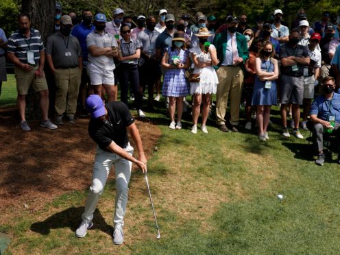 Rory McIlroy hits out of the rough on the sixth hole during the first round of the Masters (Charlie Riedel/AP)