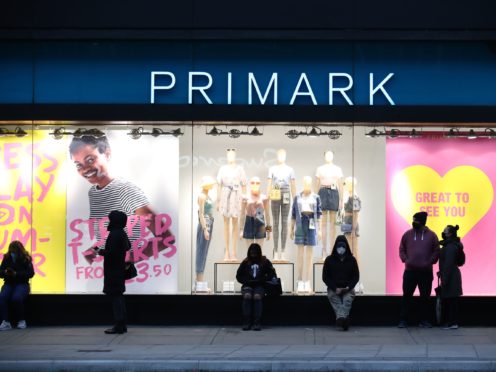 Early morning shoppers stand in line outside the Primark store in Oxford Street, London (Aaron Chown/PA)