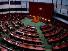Pro-China legislators attend the first and second reading of the Improving Electoral System (Consolidated Amendments) Bill 2021 at the Legislative Council in Hong Kong (Vincent Yu/AP)