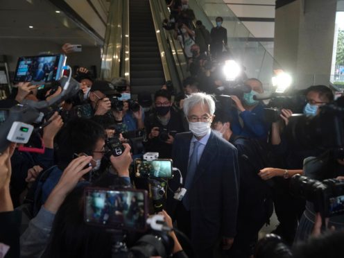 Pro-democracy activist Martin Lee, centre, arrives at a court in Hong Kong (Kin Cheung/AP)