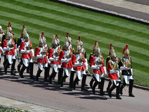 The Household Cavalry march outside St George’s Chapel, Windsor Castle (Justin Tallis/PA)
