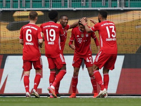 Jamal Musiala, second right, became the youngest player to reach six Bundesliga goals in Bayern Munich’s win at Wolfsburg (Michael Sohn/AP)