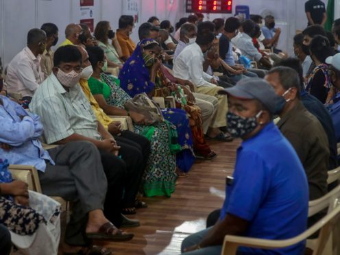 People wait to receive a vaccine in Mumbai, India (Rafiq Maqbool/AP)