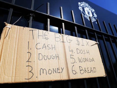 Protest sign outside Old Trafford (Tim Markland/PA)
