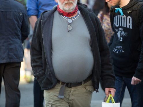 An obese man (Daniel Leal-Olivas/PA)