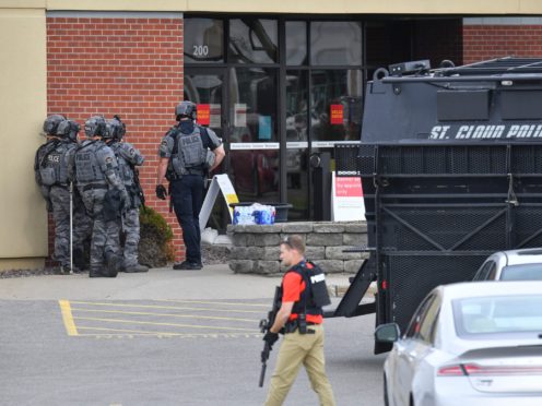 Four bank employees were released as a stand-off between an alleged hostage-taker and police continued in Minnesota (Dave Schwarz/St Cloud Times/AP)