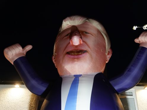 Members of Hartlepool’s business community have erected a 30 foot inflatable Boris Johnson outside the count for the town’s by-election (Owen Humphreys/PA)