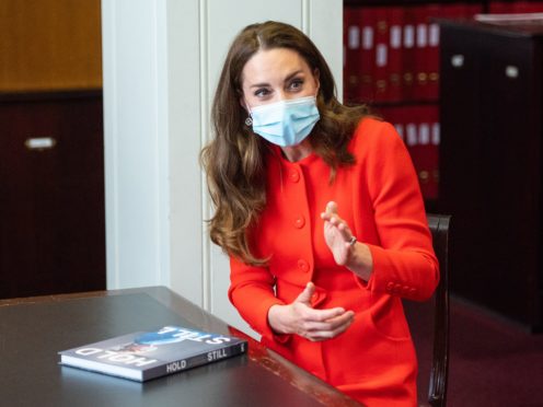 The Duchess of Cambridge talks to ‘Hold Still’ entrants during a visit to the archive in the National Portrait Gallery in central London (Dominic Lipinski/PA)