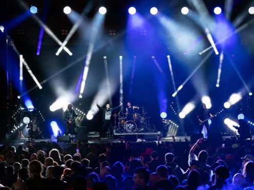 Festivalgoers watch Death Blooms on stage on the first day of Download Festival at Donington Park in Leicestershire (Joe Giddens/PA)