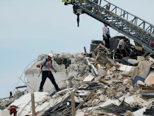Rescuers hunt for signs of life among the rubble at the collapsed Champlain Towers in Surfside (Lynne Sladky/AP)