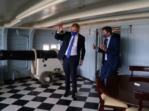 Oliver Dowden (left) with Andrew Baines, deputy executive director of museum operations (Andrew Matthews/PA)