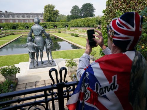 Members of the public view the statue of Diana, Princess of Wales (Jonathan Brady/PA)