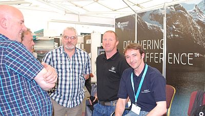 David Goodlad (left) and Iain Macleod (right) in discussions with Arthur Campbell (middle) and others from MHS at the AquacultureUK 2014 show in Aviemore