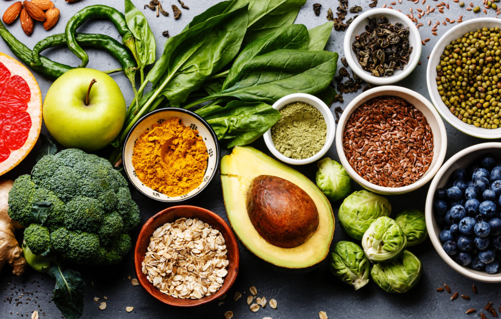 A selection of healthy fruits, vegetables, nuts and seeds