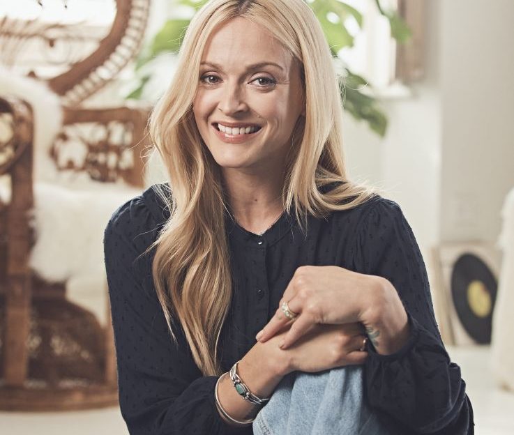 Fearne Cotton sat in her living room smiling at the camera