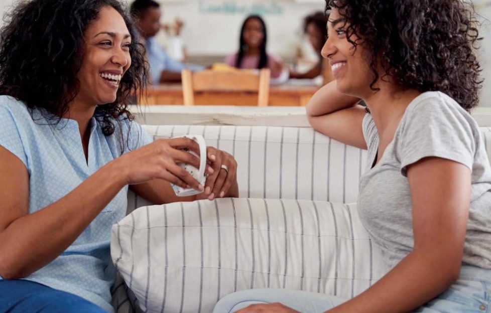 A mother and daughter chatting
