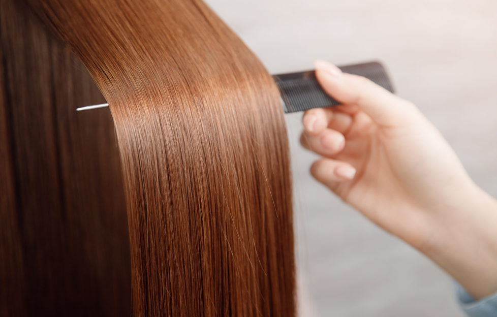 Shiny hair being brushed