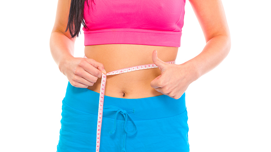 Lady measuring her waist Pic: Rex/Shutterstock