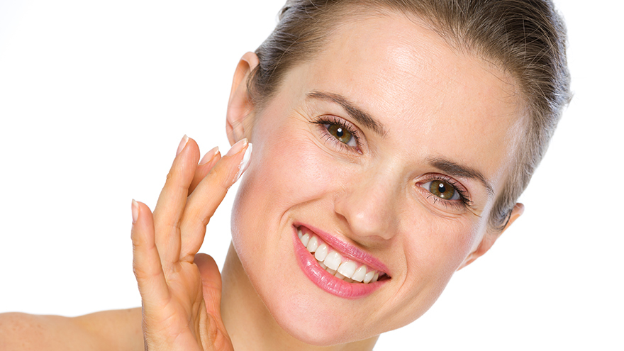 Lady applying face cream Pic: Dreamstime