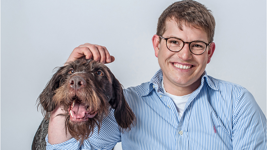 Man in glasses with dog