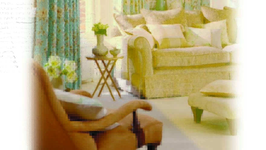 Interior of three seater sofa and chair in living room