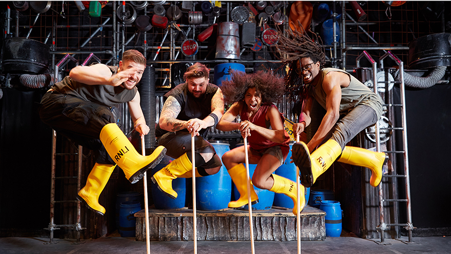 The STOMP stars in action wearing yellow wellies!