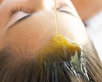 woman hair being oiled