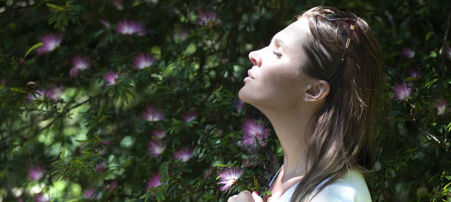 Woman with sunglasses on heat breathing deeply