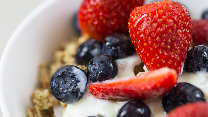 Strawberries and blueberries on cereal