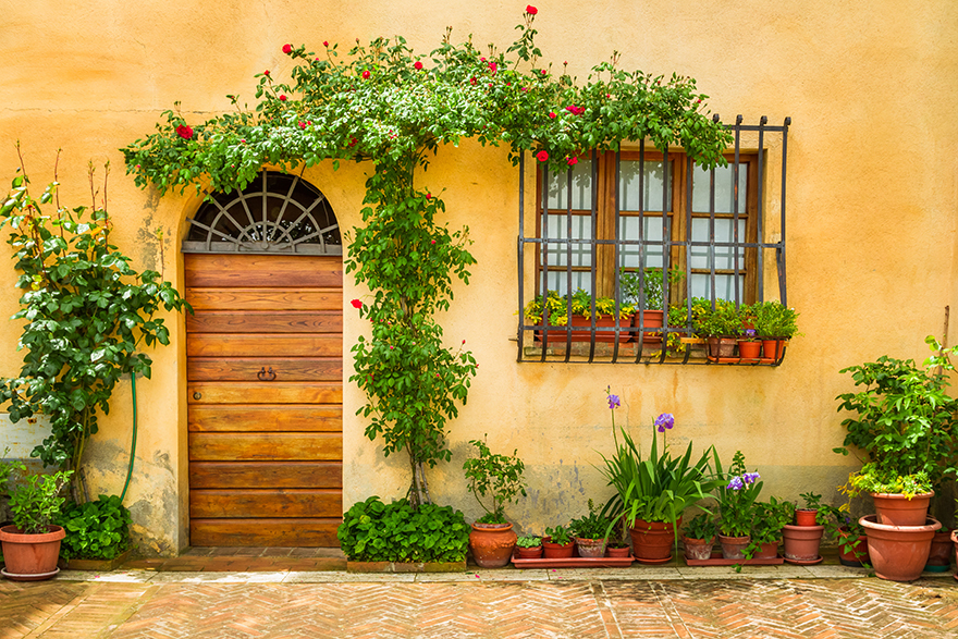 Beautiful porch decorated with flowers in italy.