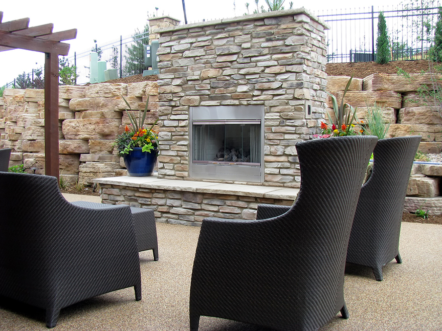 An outdoor fireplace on the patio for entertaining and relaxation