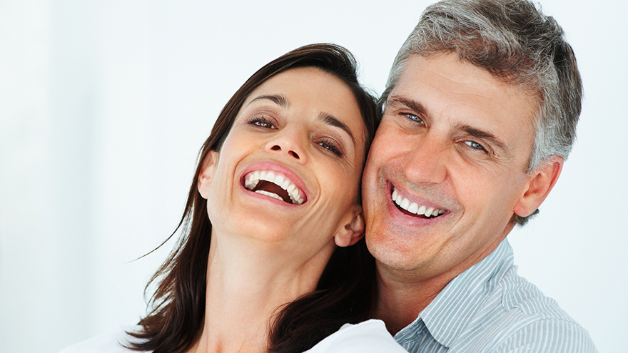 Close-up of a mature couple laughing