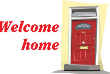 red front door with title welcome home