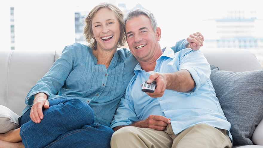 couple watching TV cuddling