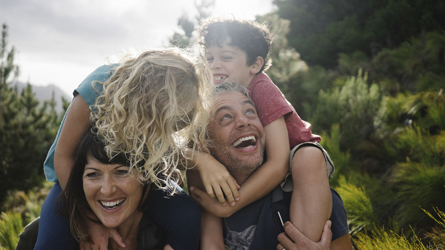 Family outdoors in the sunshine