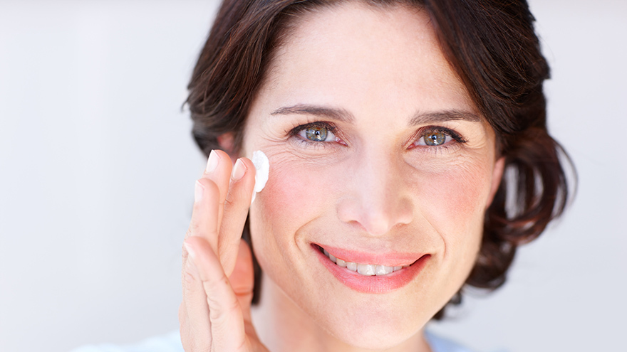 woman applying cream