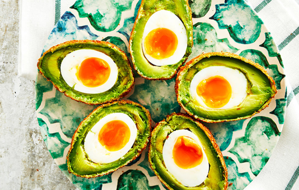 Avocado scotch eggs on a plate