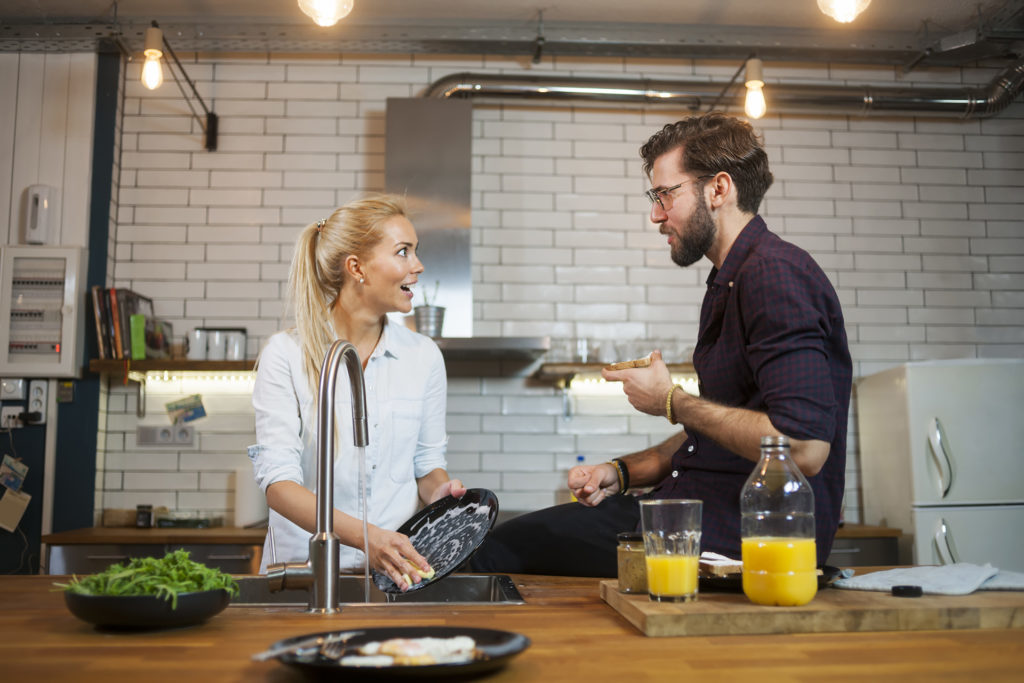 Couple spending time together in kitchen